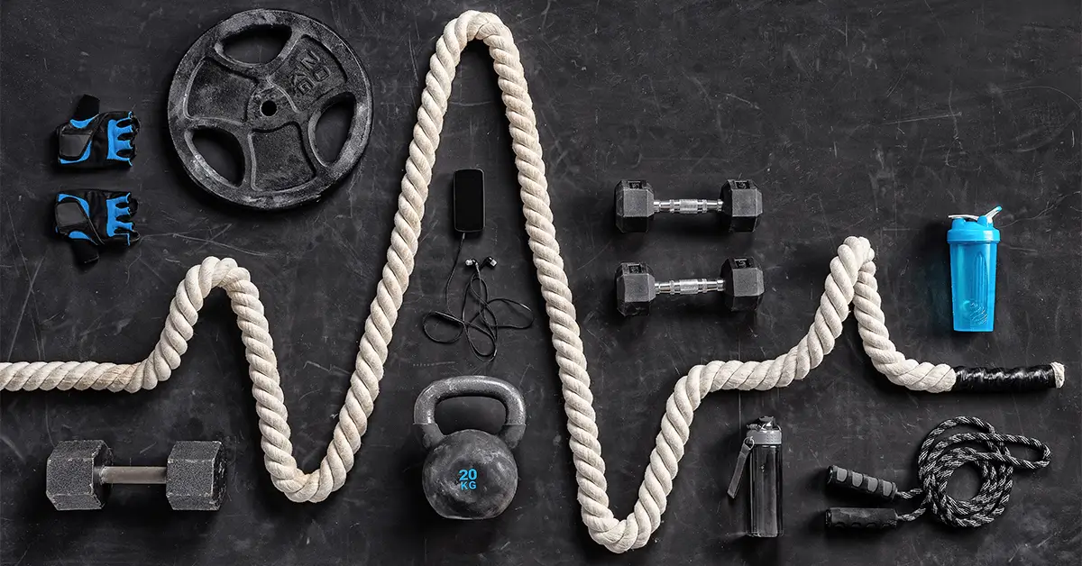 Workout Equipment arranged over a black background