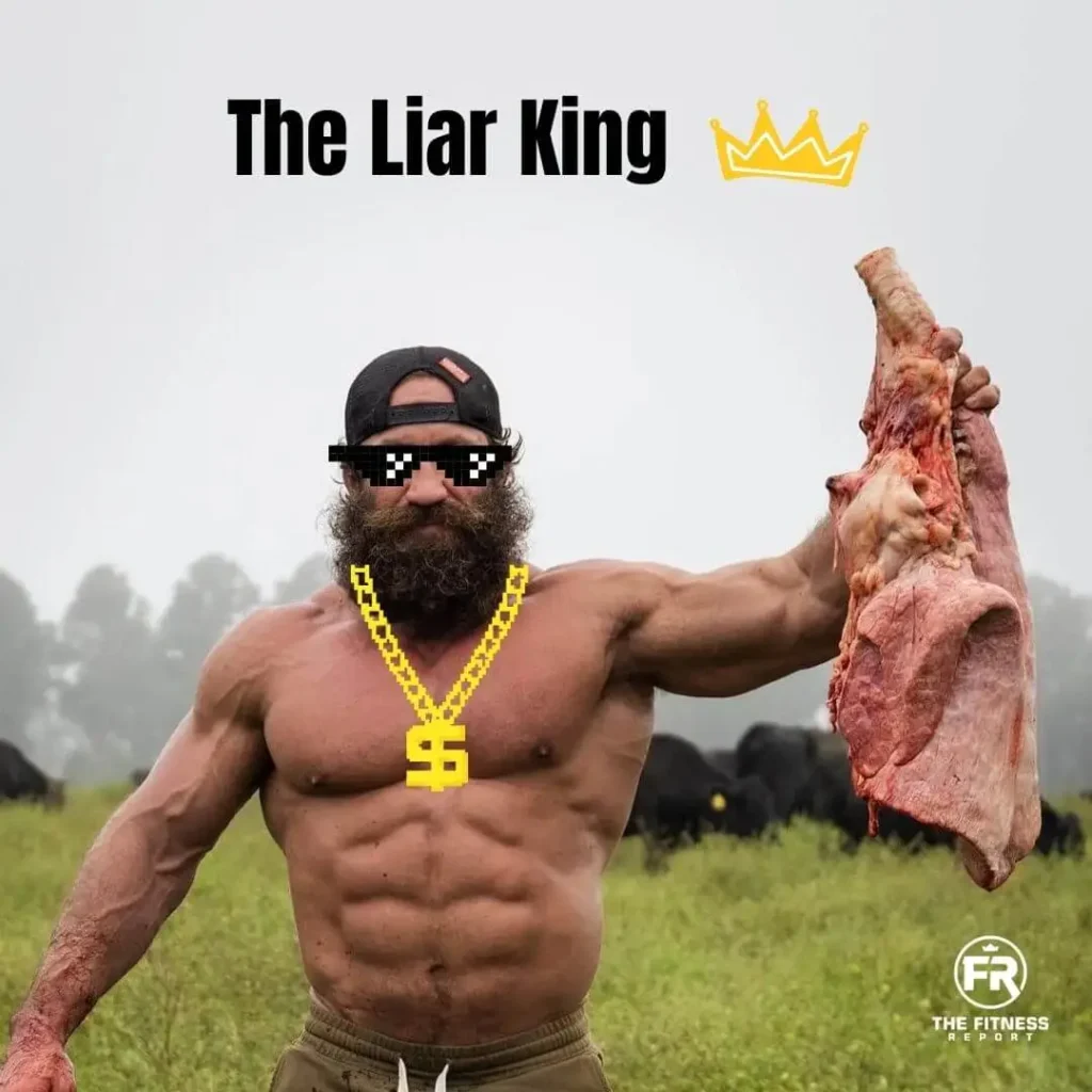 Liver King holding up a large piece of meat.