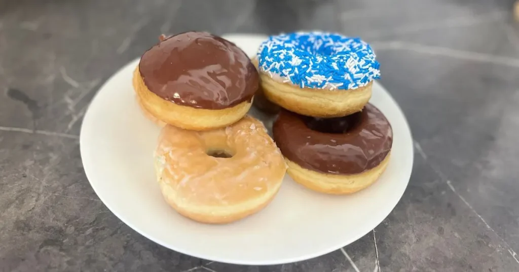 plate-of-tim-hortons-donuts - Fitness Report A plate of Tim Hortons donuts (Bismark, Vanilla Dip, Honey, Dip, Chocolate Dip)