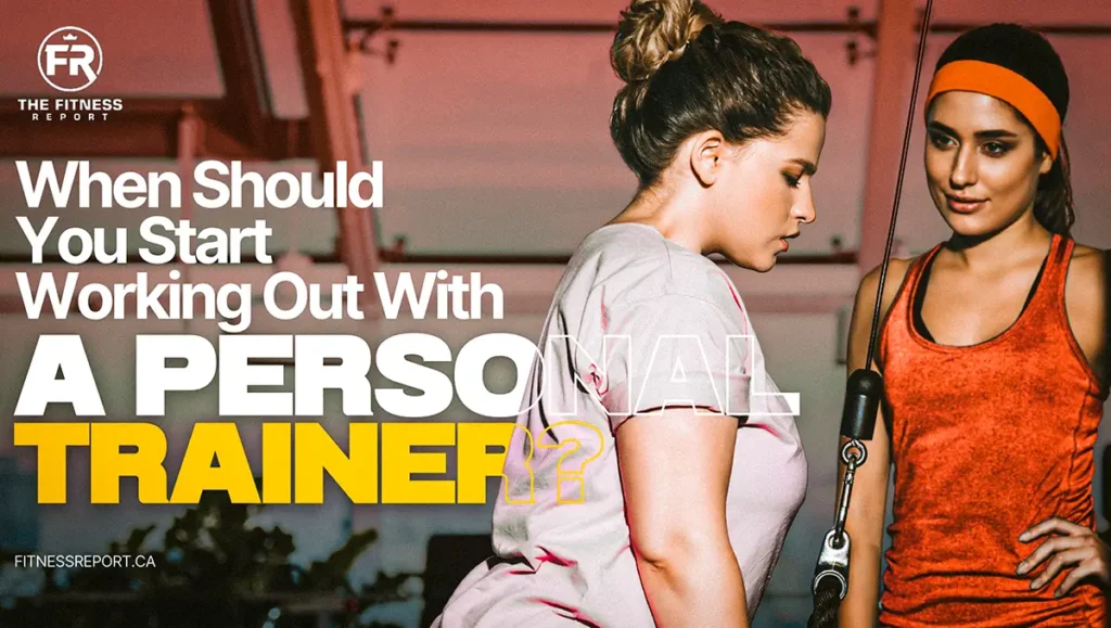 A woman doing tricep pushdowns with a rope. Her trainer is also beside her.
